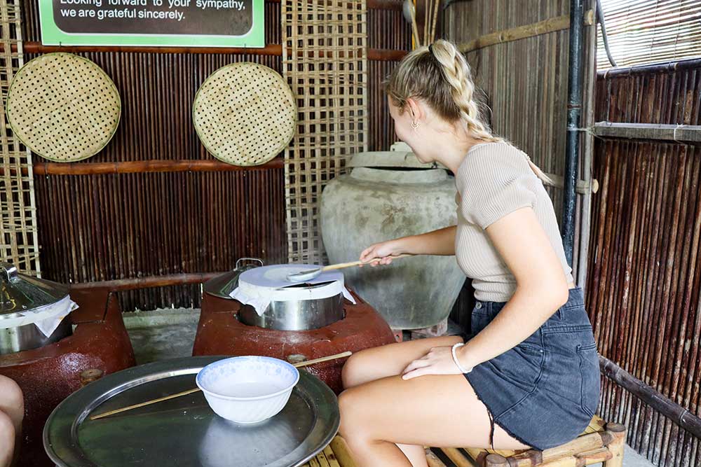 Making Rice Paper During Cooking Class Hoi An Bamboo Village in Vietnam